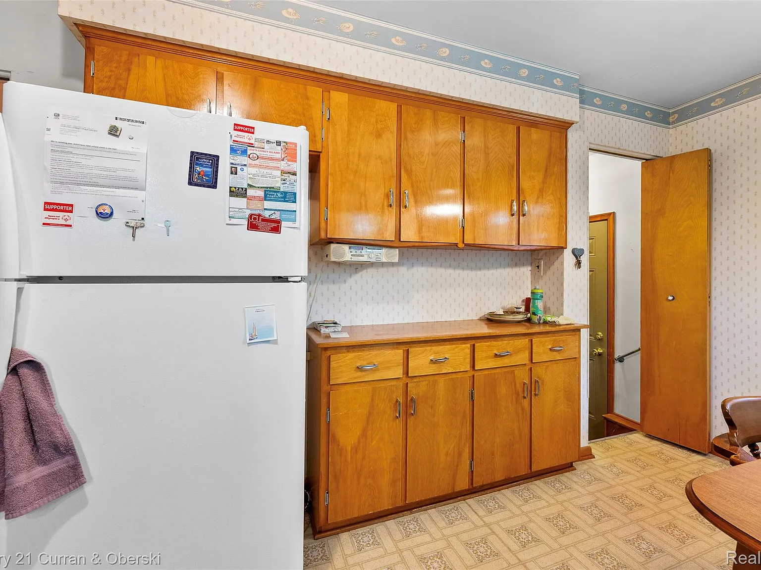 Kitchen with wood cabinets