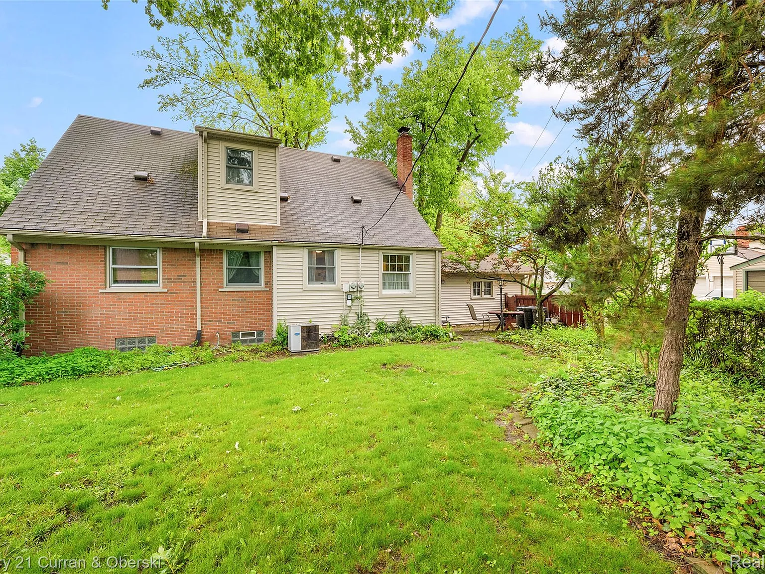 Large backyard with mature trees
